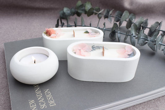 Deko Set aus Beton mit einer Kerze und getrockneten Blüten